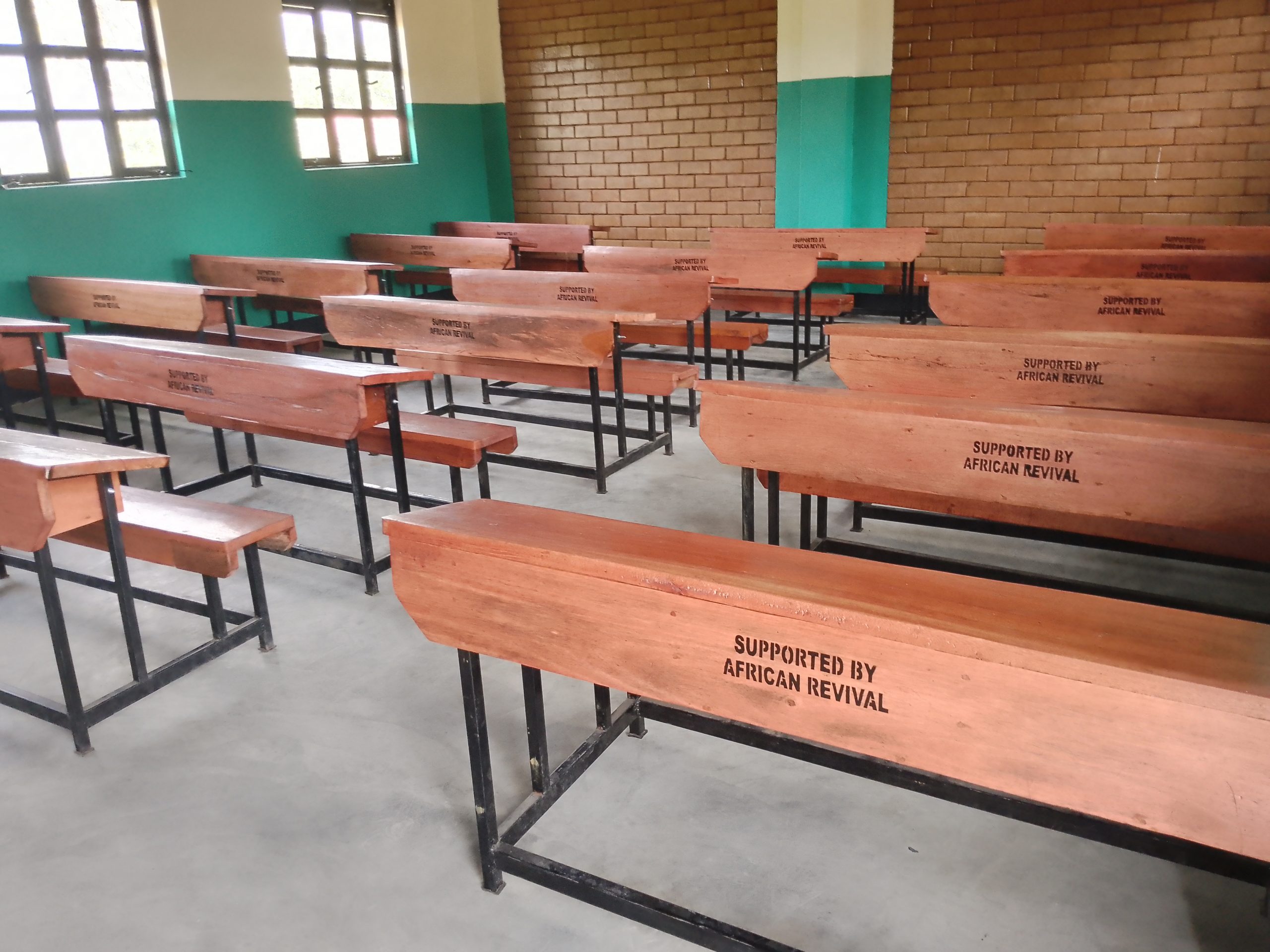Brown desks in an African Revival classroom