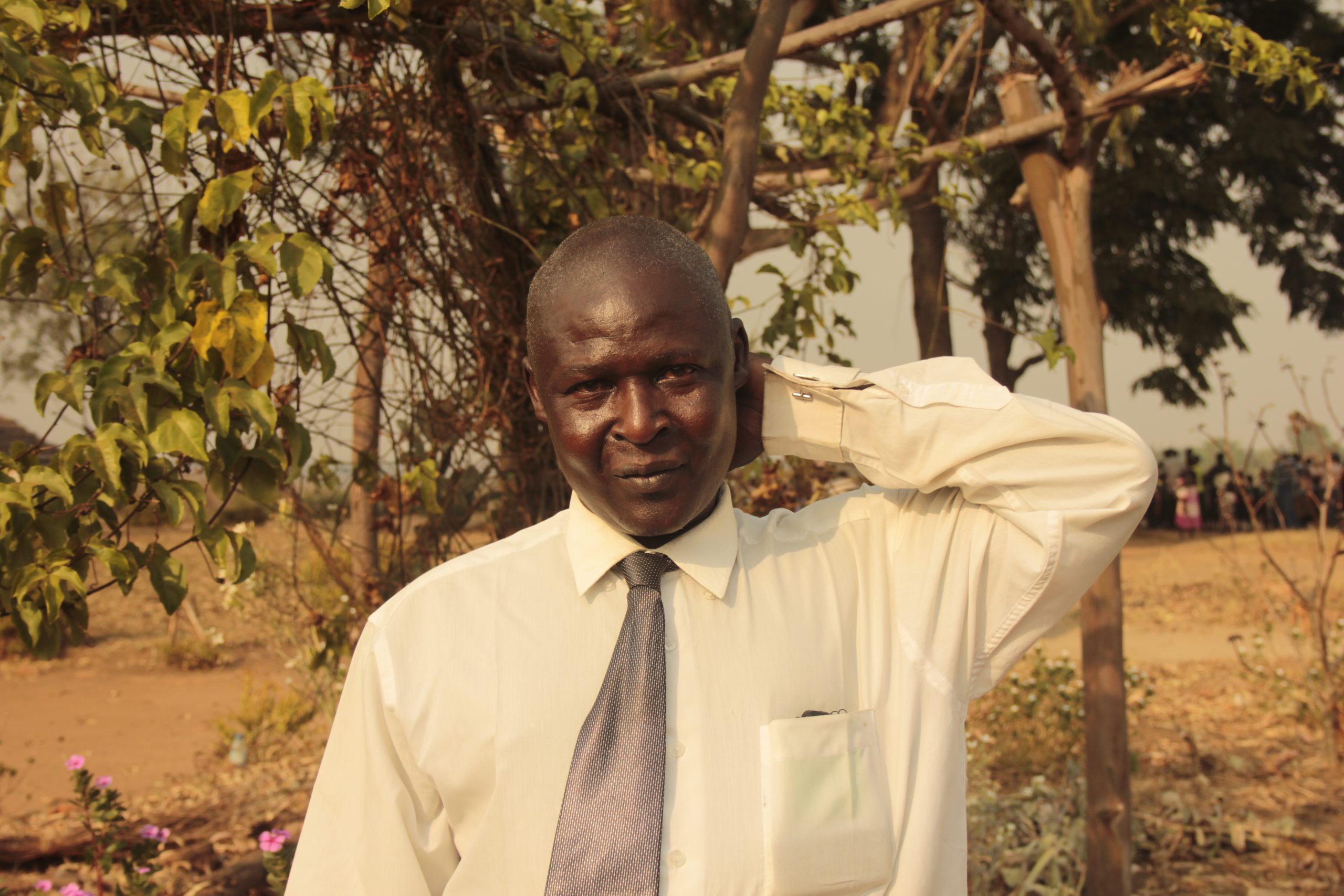 Geoffrey's story for African Revival showing him in a white shirt and tie